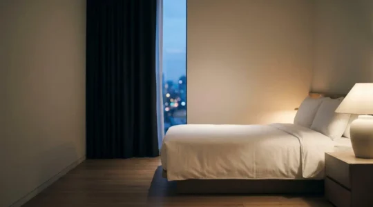Peaceful hotel bedroom with premium bedding and blackout curtains creating ideal sleep environment