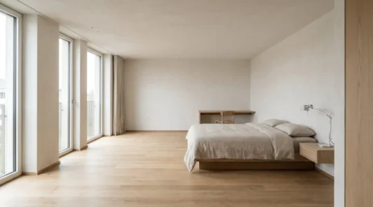 A genuinely spacious hotel room in a European city with generous floor space and abundant natural light